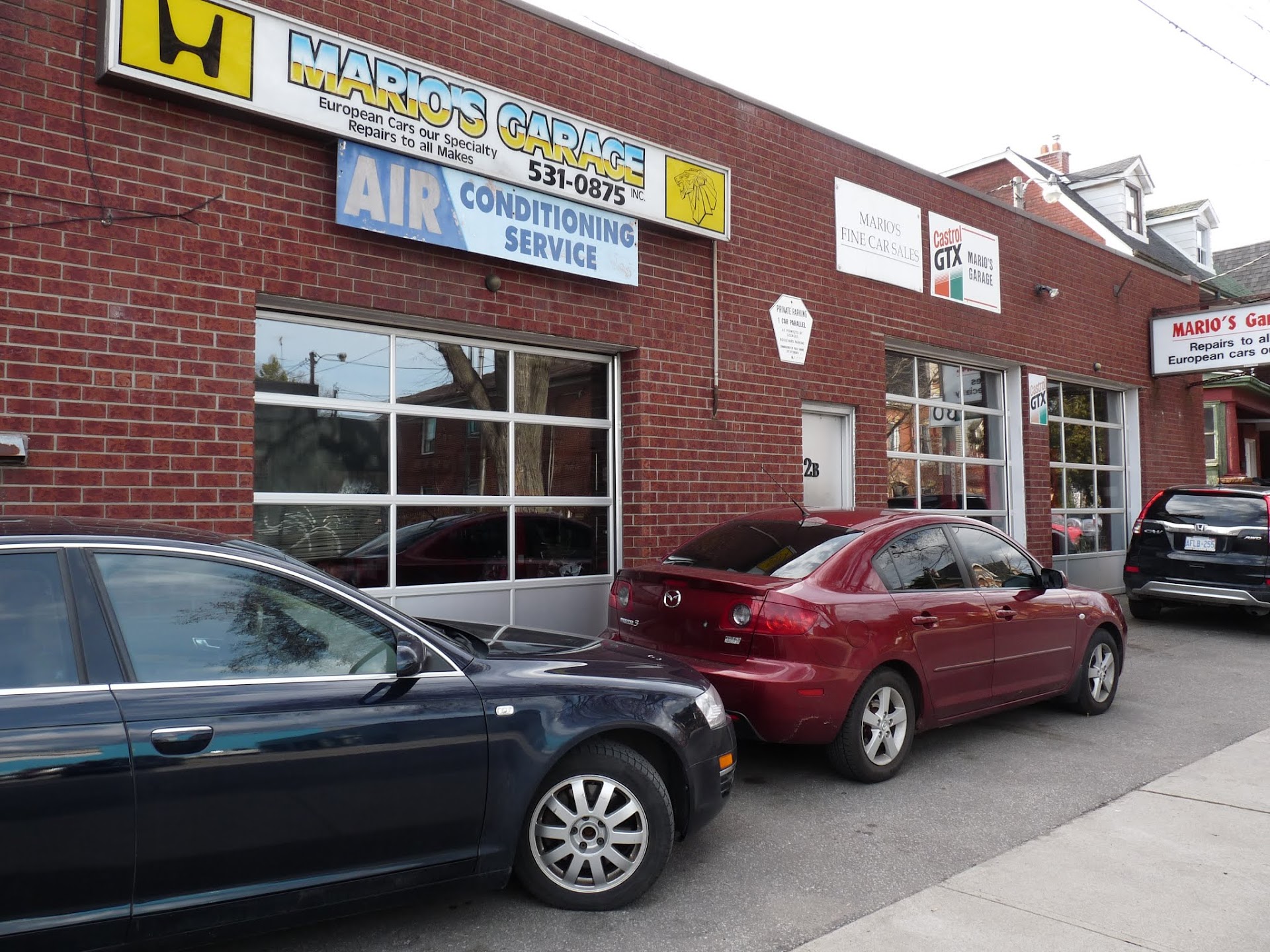 Mario's Garage brick storefront and service bays on Fennings Street in Toronto